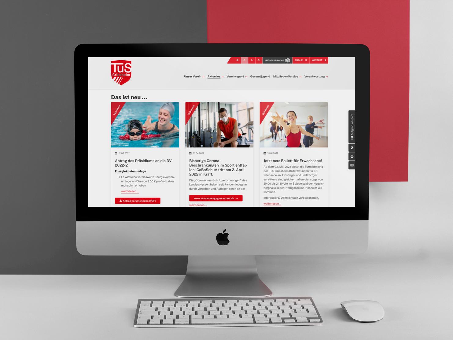 iMac mit Abbildung einer Vereinswebsite – Startseite mit Newsslider